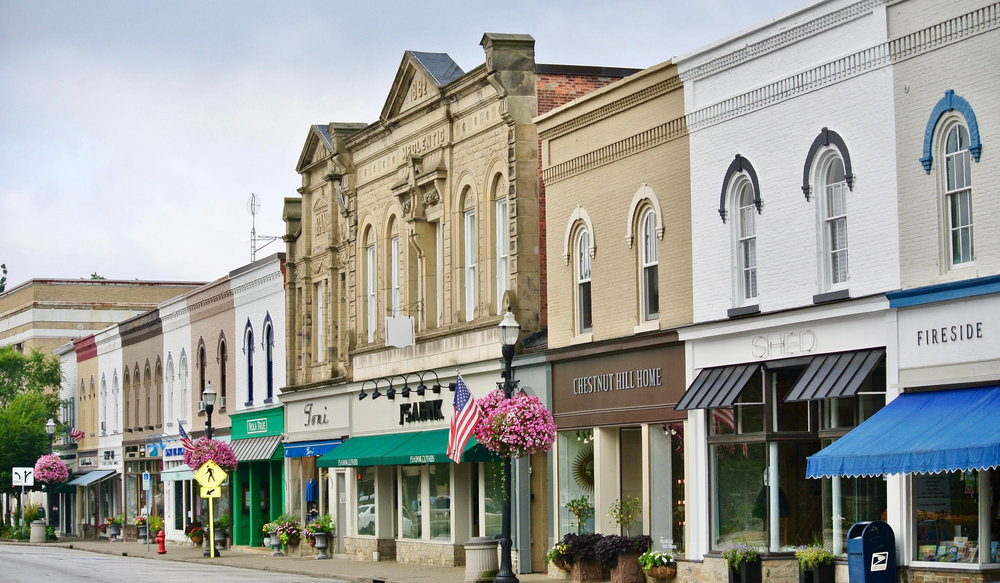 A row of buildings on the side of a street.