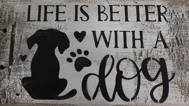 A sign that says life is better with dogs.