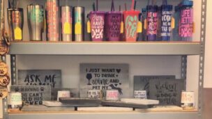 A shelf with many cups and plates on it