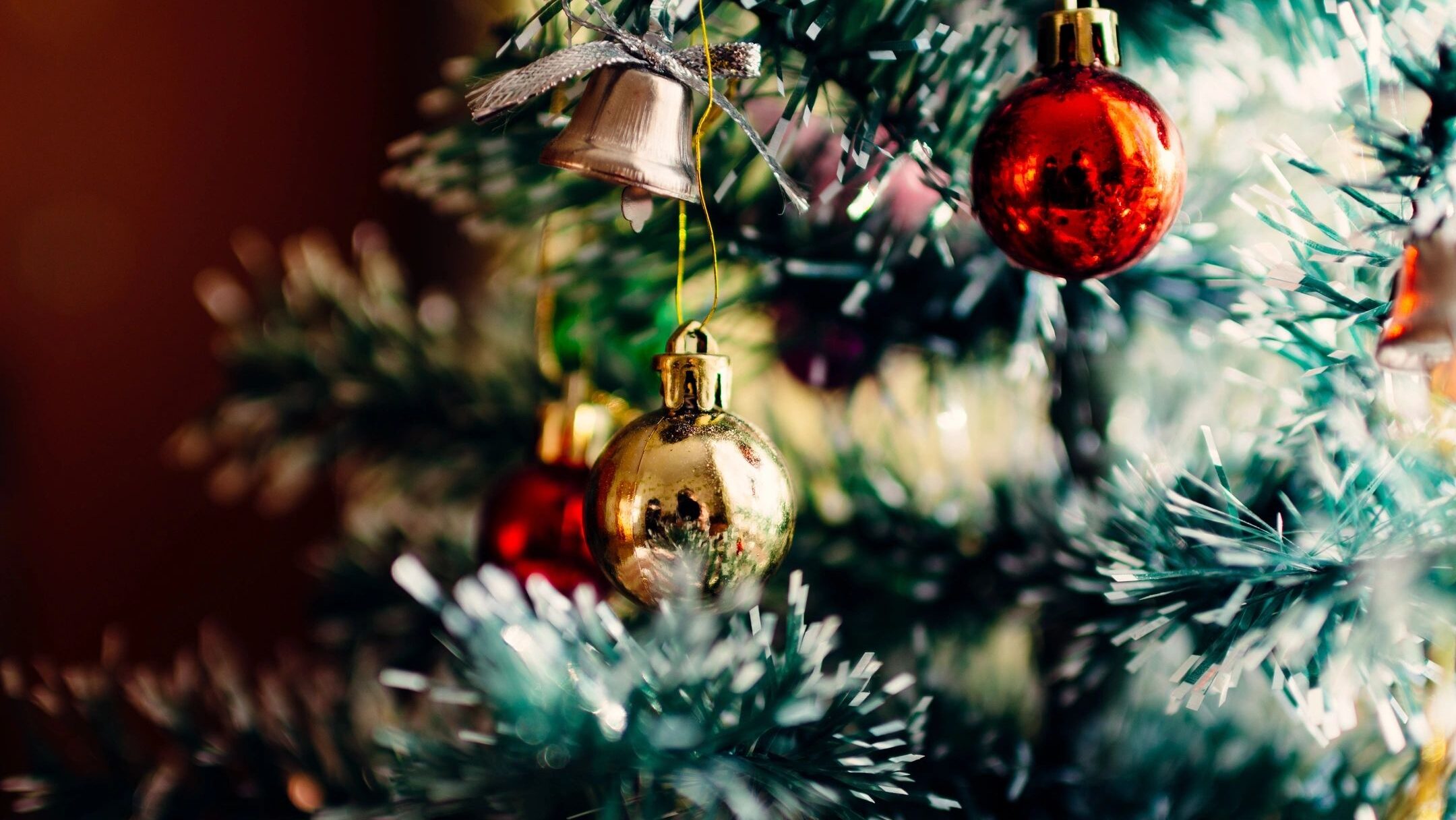 A close up of christmas decorations on the tree