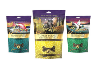 A variety of dog treats are packaged in different colors.