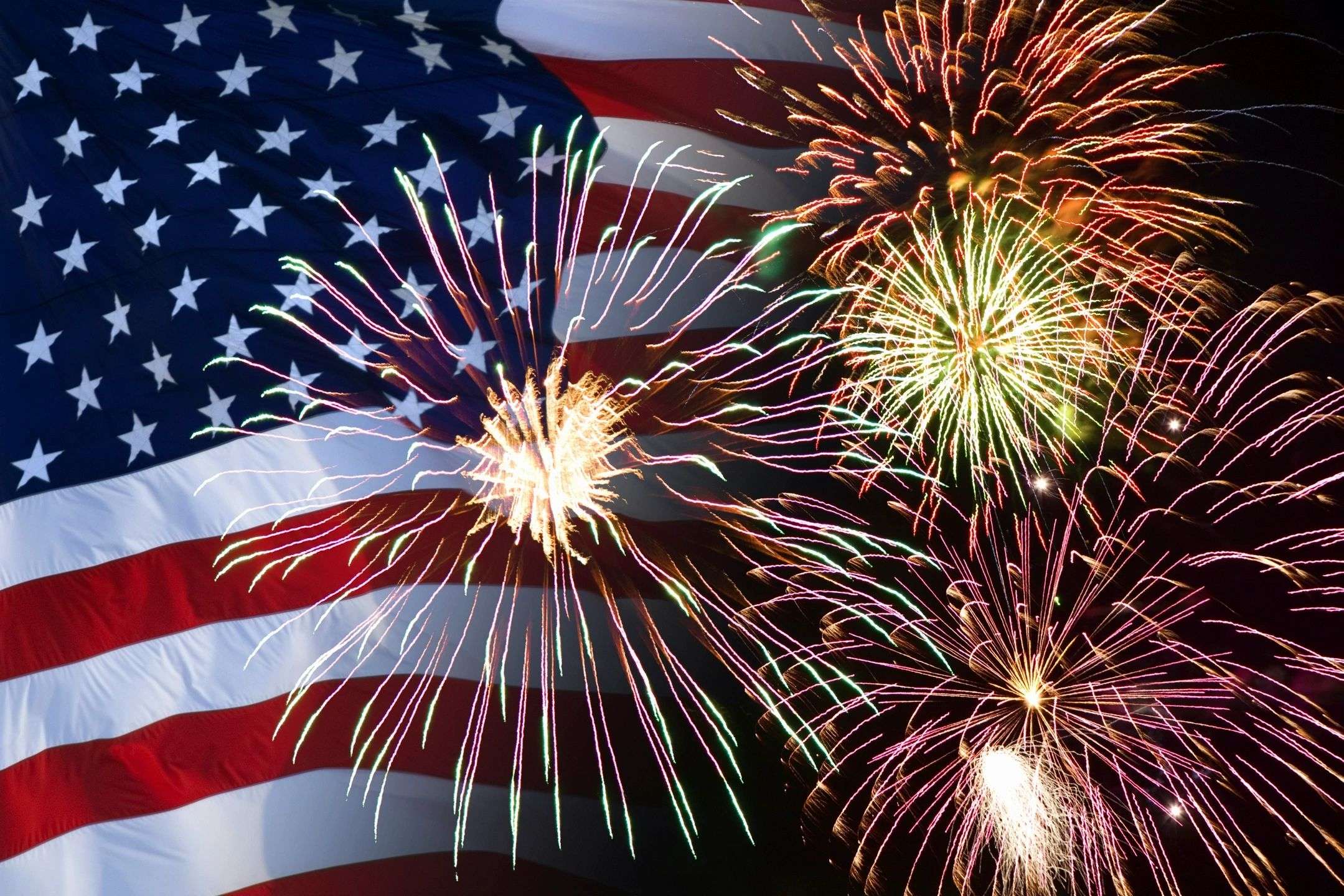 A flag and fireworks are shown in this image.