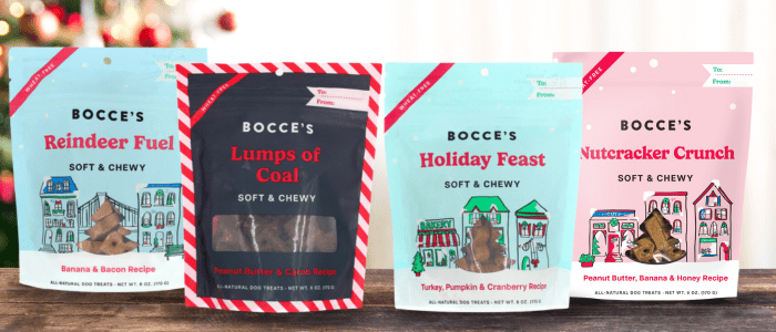 Two bags of holiday treats are sitting on a table.