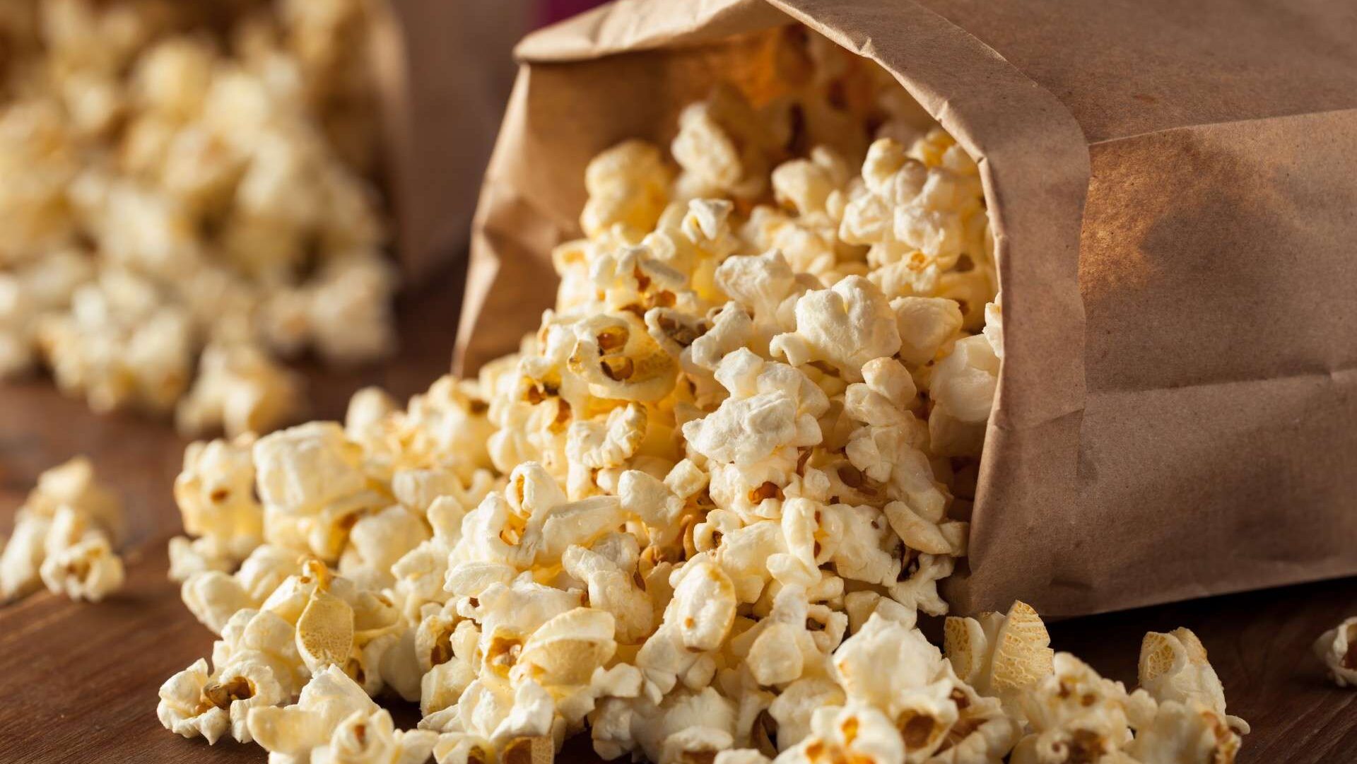 A bag of popcorn is shown with the lid open.