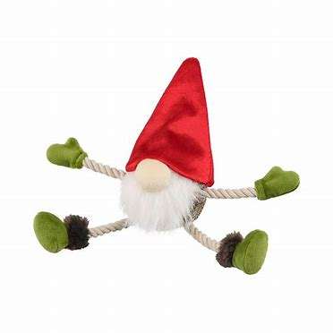 A gnome is laying down with green legs and arms.